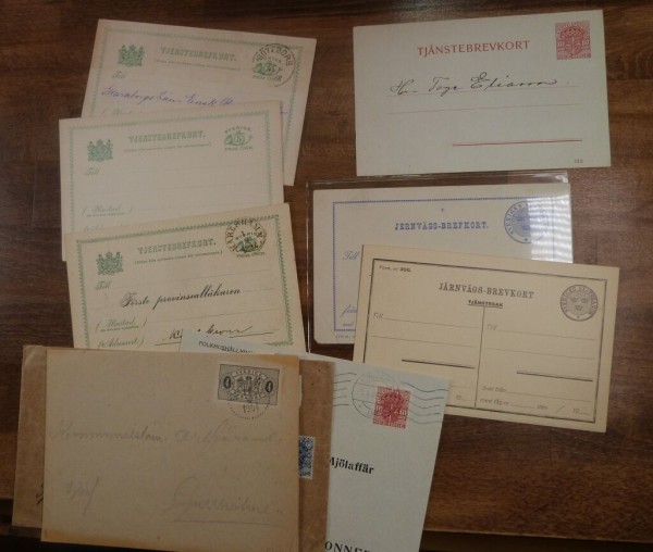 DIENST 11 Belege, fünf frankierte Briefe 1876-1918 incl. R-Brief von 1913, dazu 6 Ganzsachen */gebr.